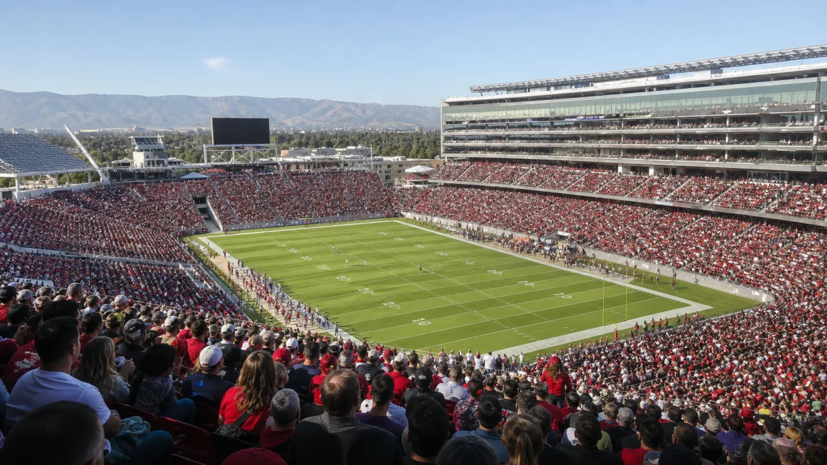 Modern Santa Clara football stadium with a huge lower bowl and tall suite tower under clear California sky