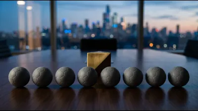 Eight identical small plain grey resin ball models in a row on a dark polished boardroom table, a single brass paperweight casting one shadow across them
