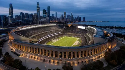 Historic Chicago lakefront stadium with classical colonnades surrounding a modern football bowl at dusk